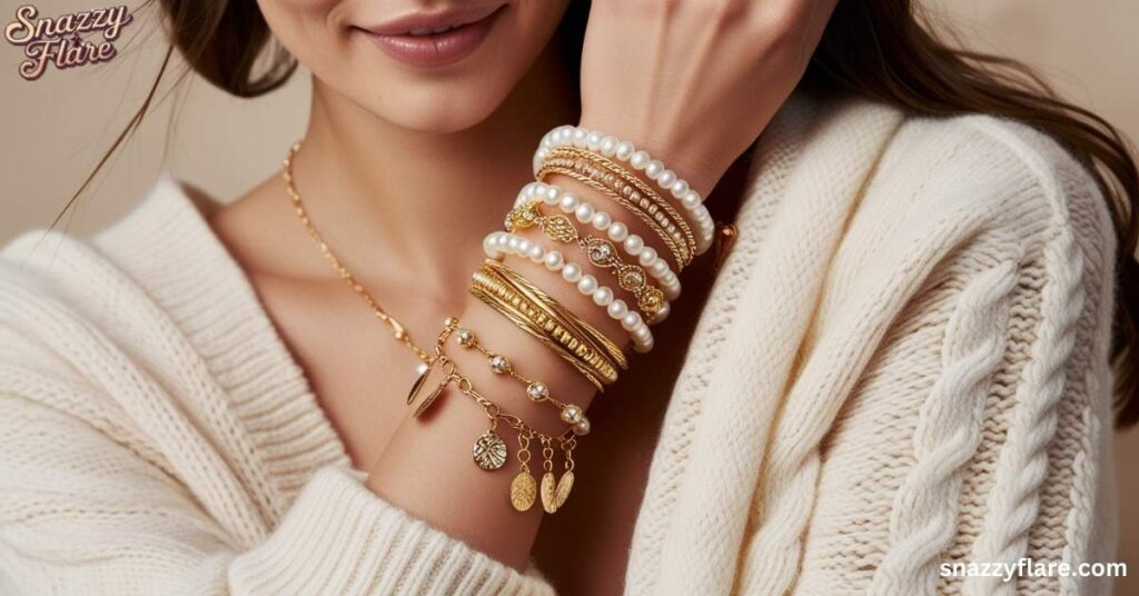 Woman wearing multiple gold and pearl bracelets, highlighting elegant jewelry