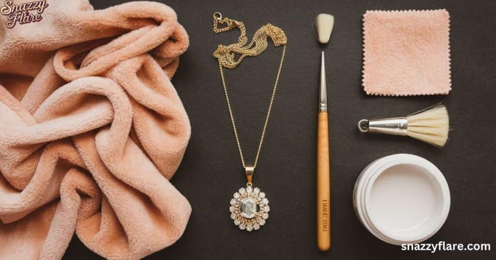 Peach towel, gold necklace with pendant, cleaning brush, sponge, and open cosmetic jar on a surface